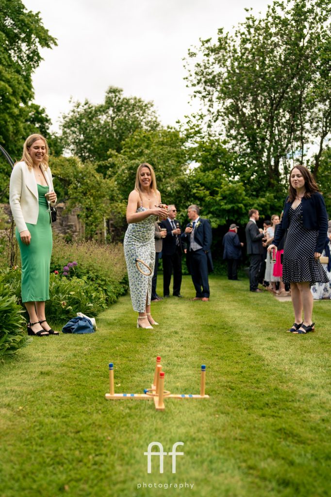 Documentary wedding photographer at Pendrell Hall capturing guests playing outdoor games