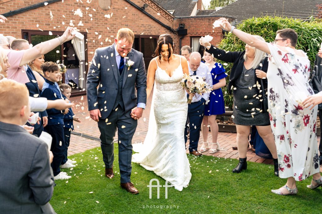Confetti being thrown at the newly married couple at Oak Farm Cannock