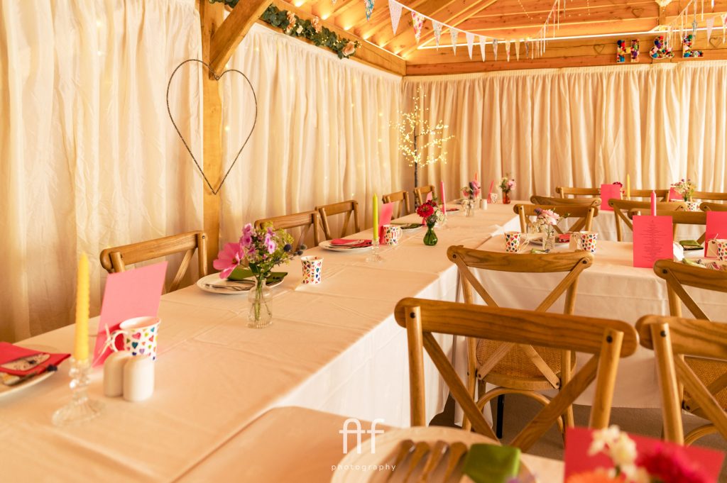 Home barn wedding reception ready to welcome the guests in from the rain and ready to celebrate
